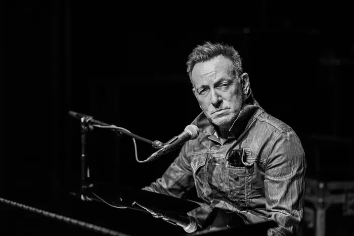 A photo of Bruce Springsteen performing on Broadway